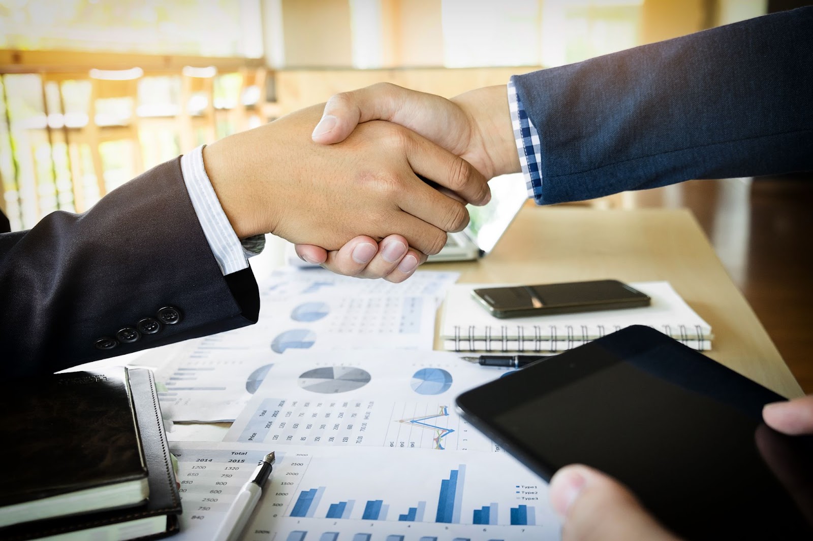 Businessmen shaking hands during a meeting