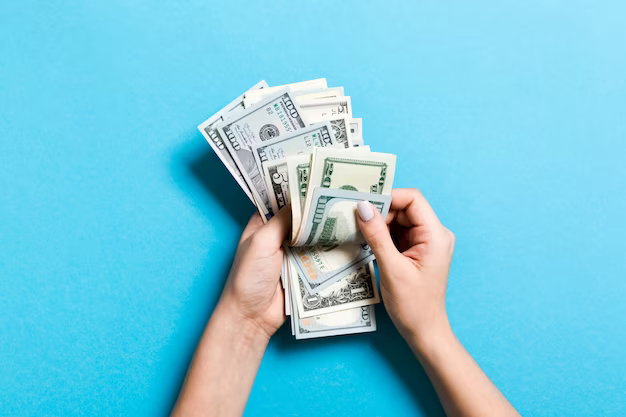 Top view of a woman's hands counting money