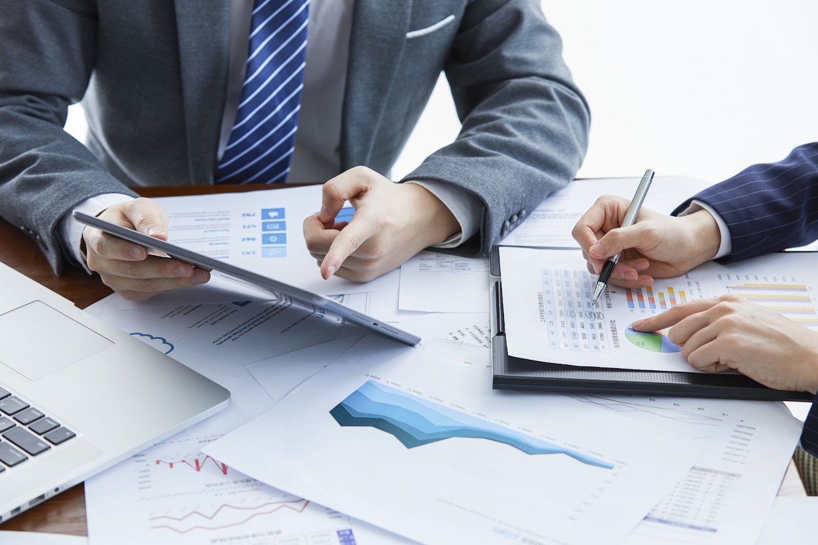 Close up of businessmen at a business meeting discussing a new project in the office